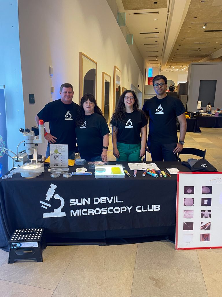 Dr. Zerrin Uzum and Dr. Page Baluch with other microscopy club volunteers at the Pattern Investigation booth at the Phoenix Art Museum