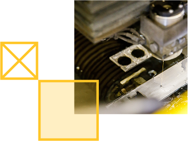 Wire EDM cutting out complex shaped parts at the Instrument Design and Fabrication Core